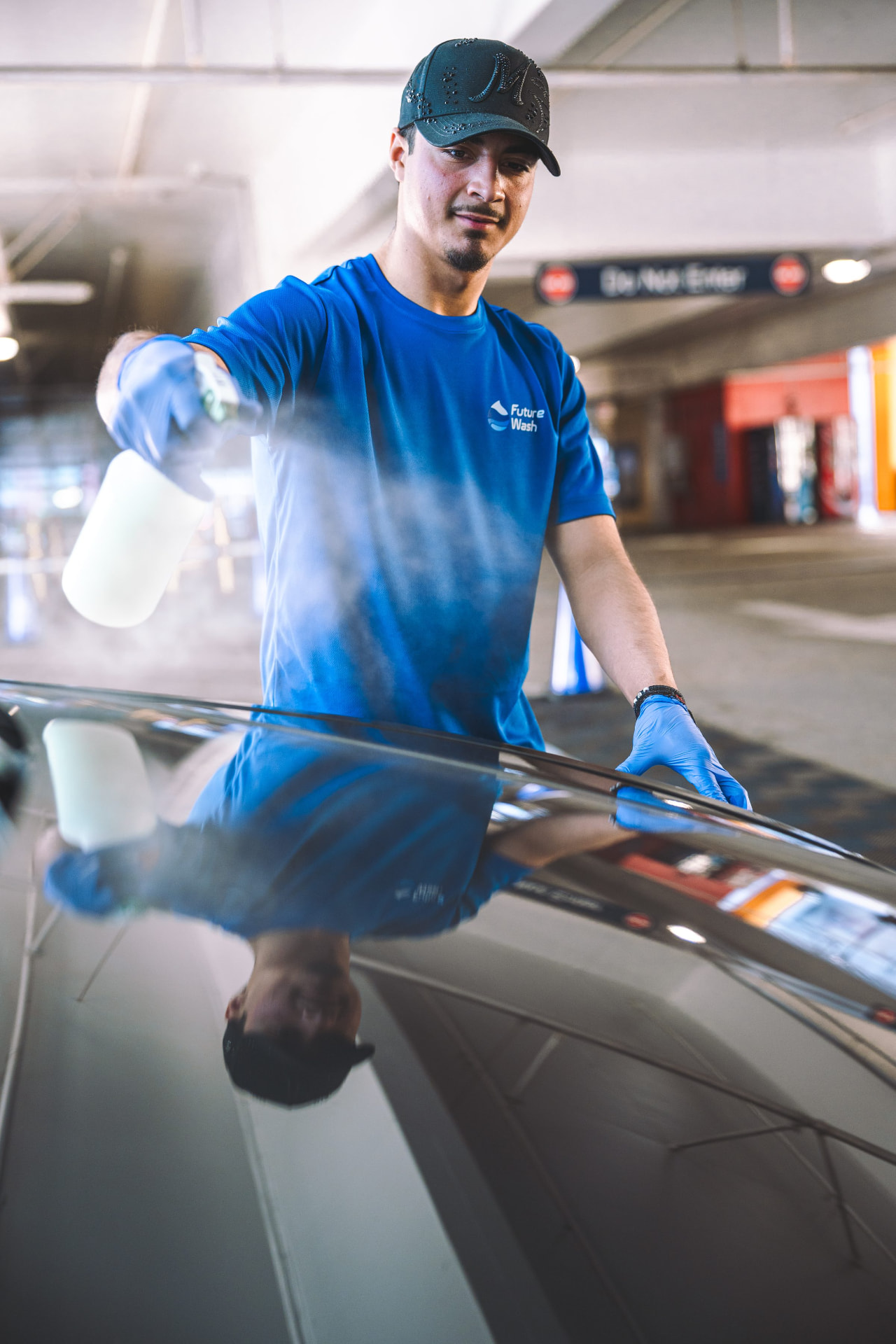 Future Wash technician preparing to detail a car in an office parking lot